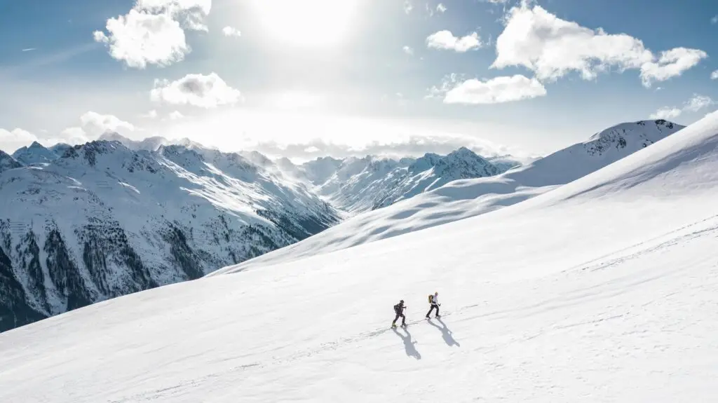 Connect travels with your hobbies, for example hiking through the snow in the alps.