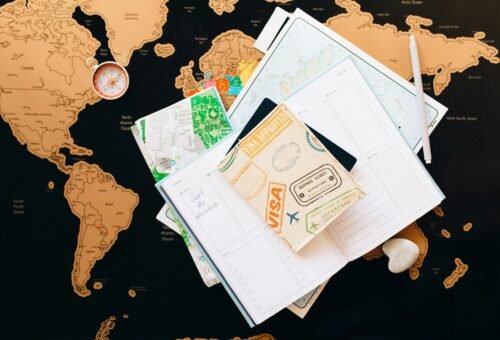 Setup for the meticulous planner: a world map and many notebooks.